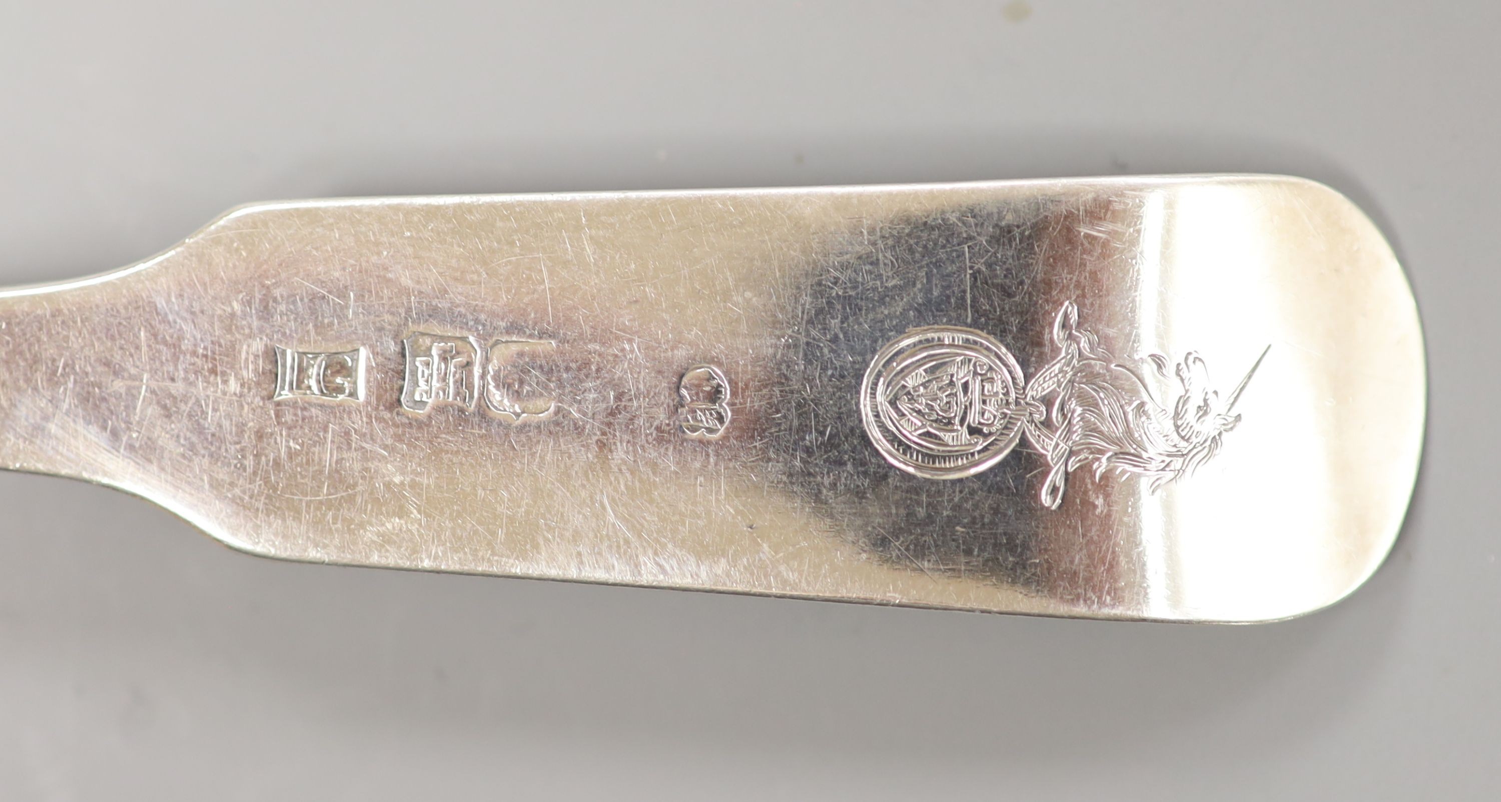A George III Scottish silver fiddle and shell pattern fish slice, John Graham, Edinburgh, c. 1806 (marks rubbed), 30cm, 139 grams.
